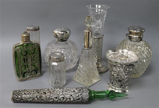 A collection of silver-mounted toilet jars, perfume flasks and flower vases, etc.,